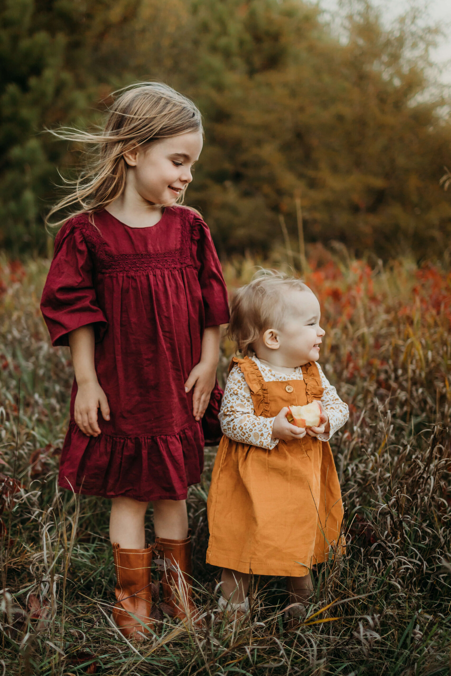 Two little girls laughing in a flower field Parenthood is so precious, but it can be challenging to remember to enjoy it. By scheduling some new things to do in Eau Claire, WI, you’ll create wonderful memories your entire family will cherish. 